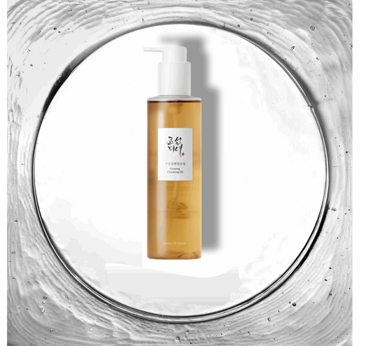 Image du Ginseng Cleansing Oil de Beauty of Joseon, une huile nettoyante enrichie en ginseng, présentée dans un flacon transparent avec une pompe dorée, symbolisant le luxe et la tradition coréenne. Ce produit est idéal pour un nettoyage en profondeur tout en nourrissant la peau, parfait pour ceux qui recherchent une solution de soin de peau efficace et naturelle, disponible exclusivement sur Beauty-Care.ma au Maroc.