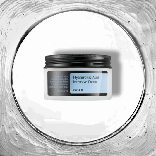 Hyaluronic Acid Intensive Cream de COSRX, présentée dans un pot robuste avec une étiquette claire, posée sur un fond épuré pour accentuer les propriétés hydratantes du produit. Cette crème riche est enrichie en acide hyaluronique, connue pour ses capacités exceptionnelles à retenir l'humidité, parfaite pour hydrater intensément les peaux sèches. Disponible pour les amateurs de soins de la peau au Maroc sur Beauty-Care.ma.